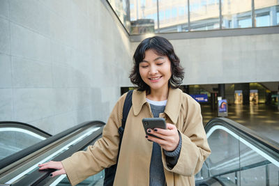 Young woman using mobile phone