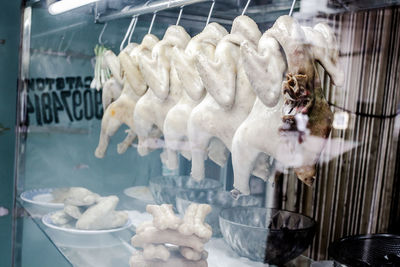 Chickens hanging in shop for sale