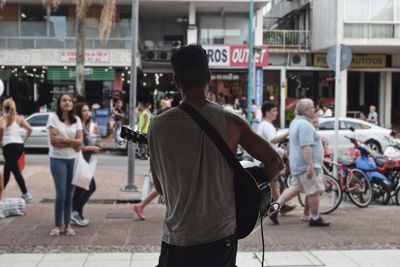 Man playing guitar in market