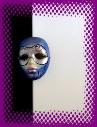 Close-up of mask on purple table