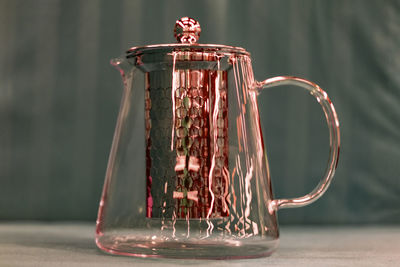 Close-up of glass jar on table