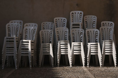Stack of chairs in row