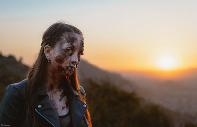 Portrait of man against sky during sunset