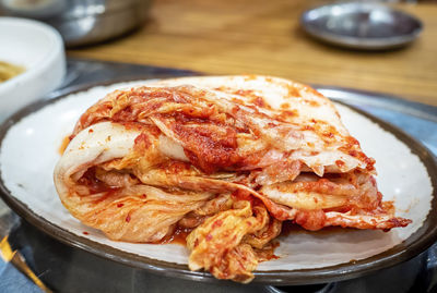 Close-up of korean kimchi in plate on table