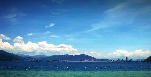 Scenic view of mountains against cloudy sky