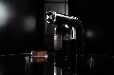 Close-up of coffee with glass of water