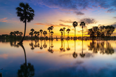 Scenic view of lake against sky during sunset