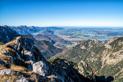 Scenic view of mountains against clear blue sky