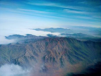 View of mountain range against cloudy sky