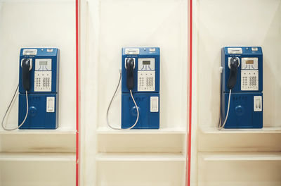 Close-up of telephone booth on wall