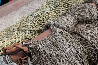 High angle view of fishing nets and buoys on pier