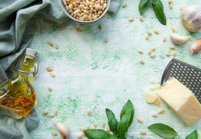 Ingredient for pesto sauce - fresh basil, pine nuts, olive oil and cheese