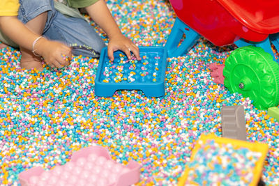 Midsection of woman playing jigsaw puzzle