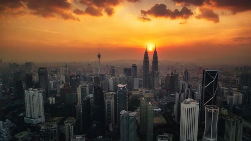 View of cityscape against sky during sunset