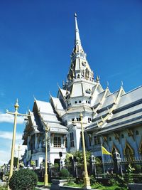 Low angle view of temple against clear blue sky