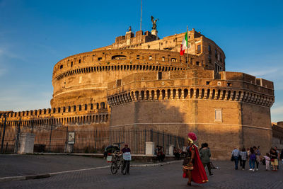 Tourists at the beautiful mausoleum of hadrian also called sant angelo castle built on 139 ad