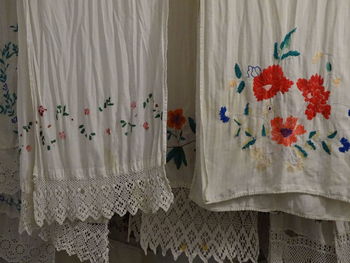 Close-up of white curtain hanging at home