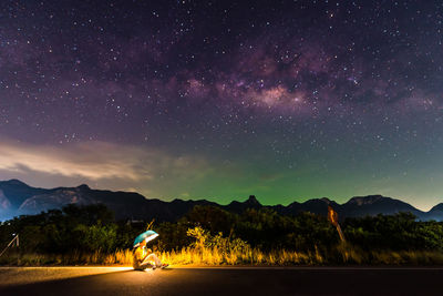 Scenic view of mountains against sky at night