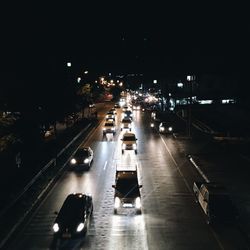 High angle view of cars on road in city at night