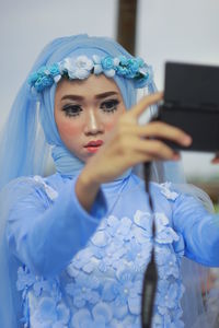 Young woman wearing dress indoors