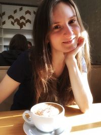 Young woman drinking coffee cup