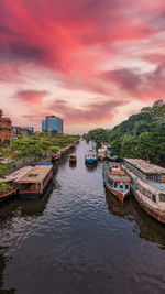 Boats moored at harbor