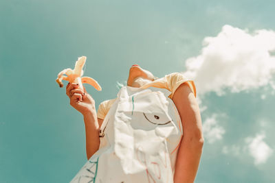 Low angle view of woman against sky