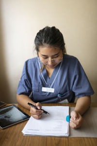 Nurse filling documents