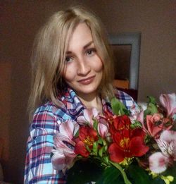 Portrait of beautiful woman with red poppy flowers