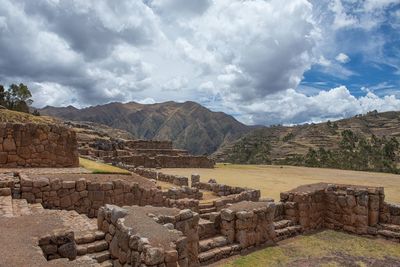 Old ruins of building against cloudy sky