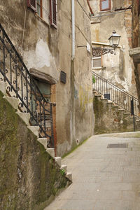 Narrow alley amidst buildings in town