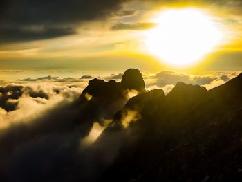 Scenic view of mountains against sky during sunset