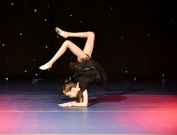 Full length of ballet dancer on stage