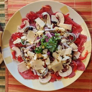 High angle view of chopped fruits in plate on table