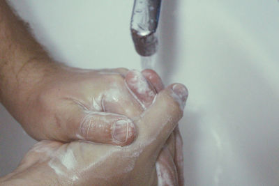 Close-up of hand holding water
