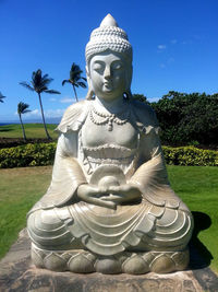 Statue of buddha against sky