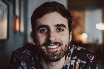 Close-up portrait of a smiling young man