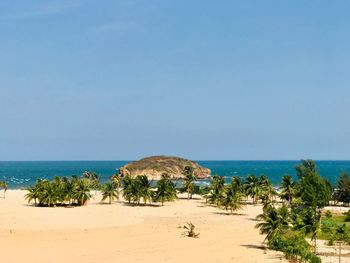 Scenic view of beach against clear sky