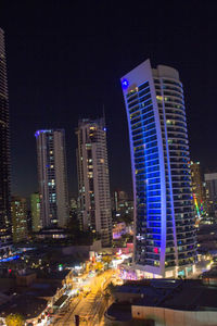 Modern buildings in city at night