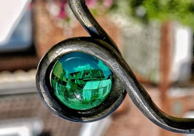 Close-up of reflection on metal mirror