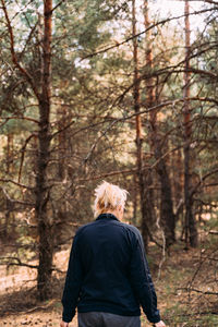 Rear view of woman in forest
