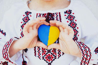 Midsection of woman with balloons