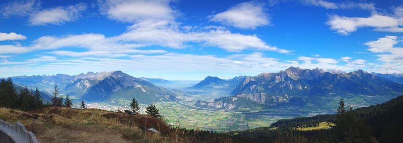 Scenic view of mountains against cloudy sky