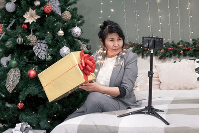 Portrait of young woman using digital tablet