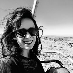 Portrait of smiling young woman on beach