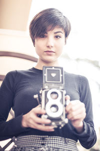 Portrait of woman photographing