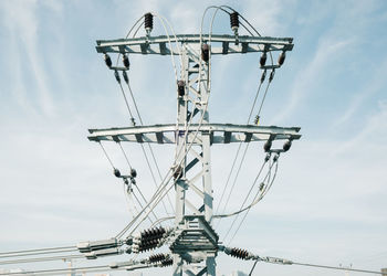 Low angle view of ferris wheel against sky