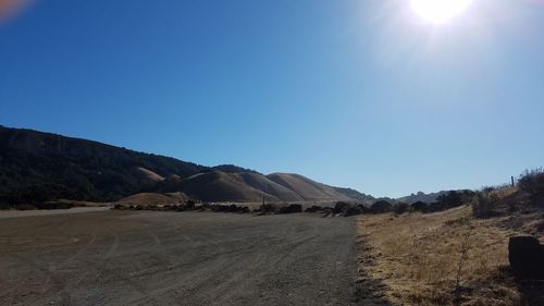 Scenic view of mountains against clear blue sky