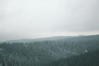 Scenic view of landscape against sky during winter