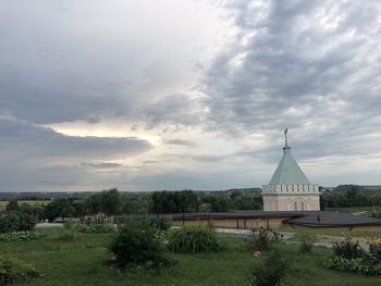 Scenic view of temple by building against sky